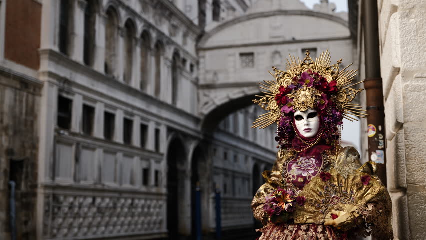 Venice - carnival masks are photographed with tourists in San Marco square Royalty-Free Stock Footage #1100325763