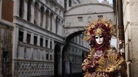 Venice - carnival masks are photographed with tourists in San Marco square - Powered by Shutterstock - Get 15% off with code: PIKWIZARD15