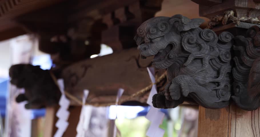 A statue of guardian dog at Japanese Shrine handheld
