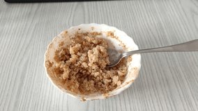 Man eats buckwheat porridge for breakfast. First person view video