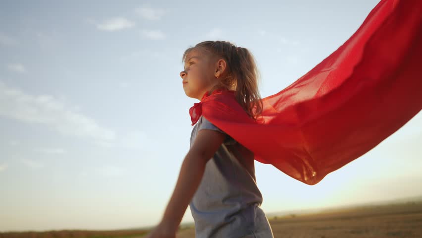 kid superhero. girl daughter happy family a dream concept. baby girl superhero close-up in red cape at sunset. portrait child superhero close-up. strength fantasy concept lifestyle Royalty-Free Stock Footage #1100332119