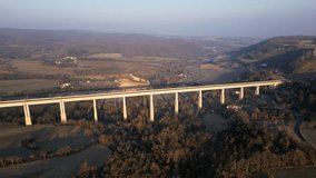 Panoramic drone view of the railway viaduct for high-speed trains. Overlooking the surrounding mountains in southern France