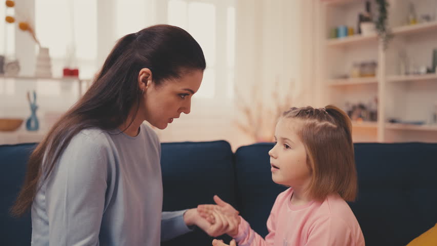 Sincere little girl talking with her mom at home, happy motherhood, friendship Royalty-Free Stock Footage #1100334647