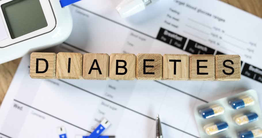 Diabetes inscription on wooden cubes on the table, close-up Royalty-Free Stock Footage #1100335395