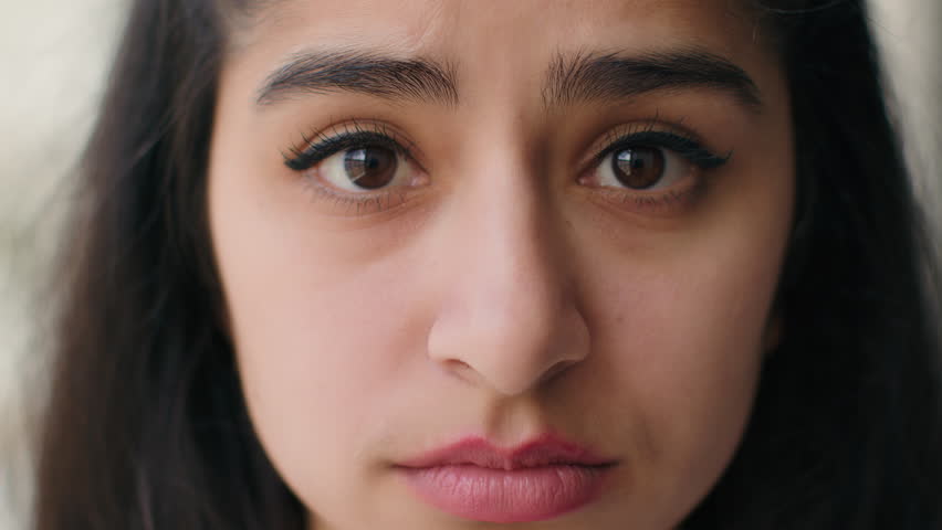 Close up woman sad face with big eyes anxious upset frustrated young teen girl businesswoman feel stress worry relations problem depression shame sorrow. Front head portrait female victim of bullying | Shutterstock HD Video #1100340745