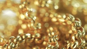 Closeup shot of gold necklaces with rotating
 - Powered by Shutterstock - Get 15% off with code: PIKWIZARD15