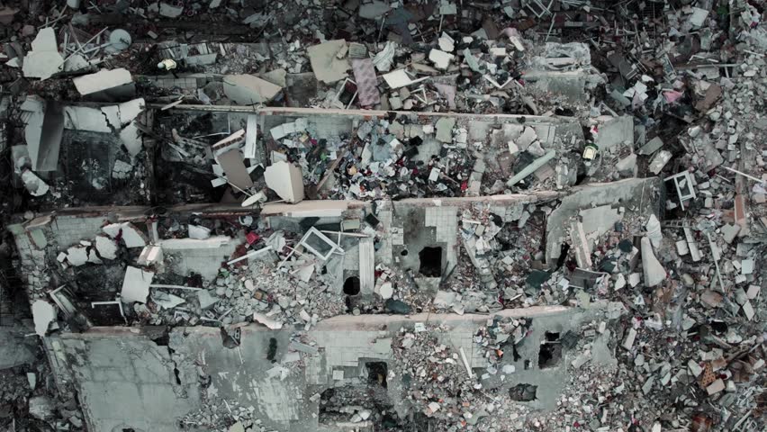 Aerial footage captures the devastating aftermath of a 7.7 magnitude earthquake that struck Turkey on February 6, 2023.  Royalty-Free Stock Footage #1100343999