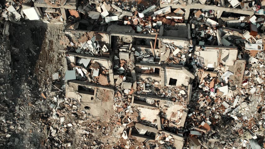 Aerial footage captures the devastating aftermath of a 7.7 magnitude earthquake that struck Turkey on February 6, 2023.  Royalty-Free Stock Footage #1100344013