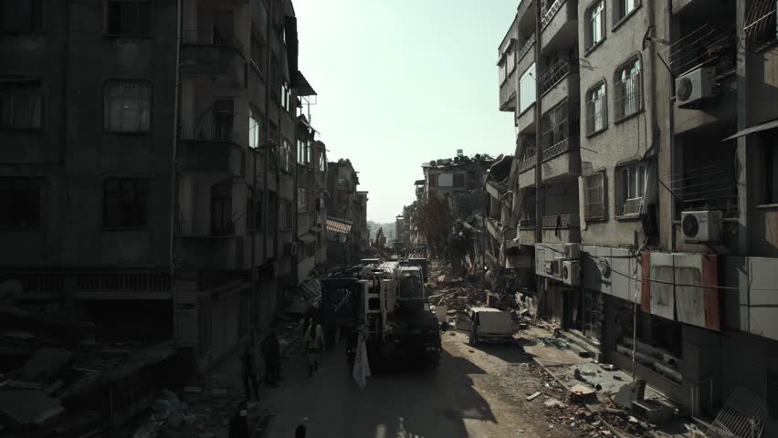 Aerial footage captures the devastating aftermath of a 7.7 magnitude earthquake that struck Turkey on February 6, 2023.  Royalty-Free Stock Footage #1100344017