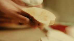 Brown bread cut in slices. Bread slicing