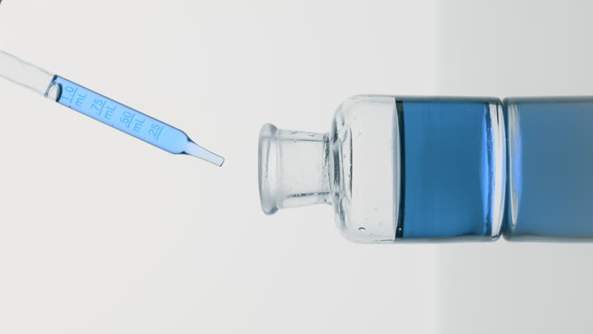 Abstract skin nutrition cosmetics formulating concept | Vertical side view big close-up shot of lab pipette drips cyan oil into reagent bottle on grey background Royalty-Free Stock Footage #1100344827