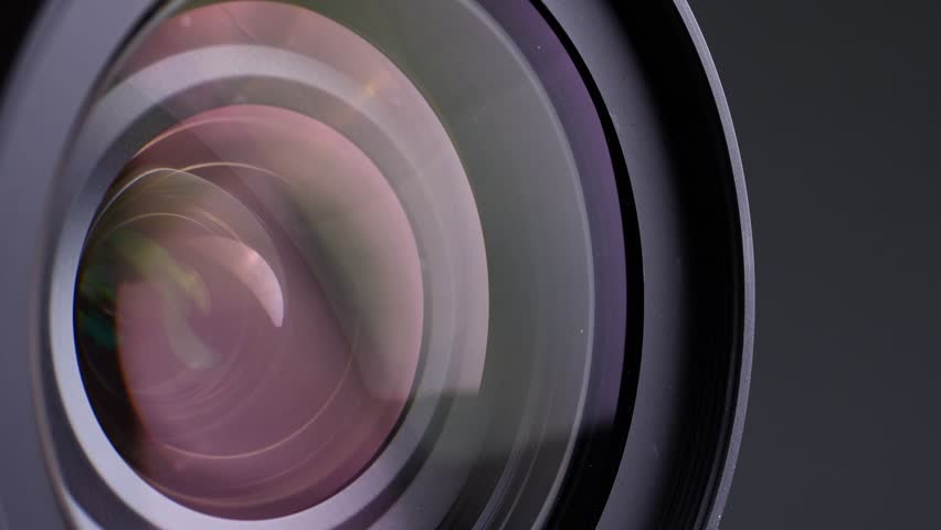 Close up of camera lens on black background.