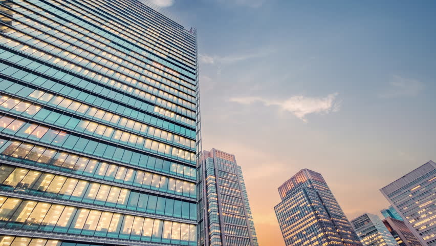 Twilight sky time lapse view looking up at modern office building. Business, corporate  and finance concept. | Shutterstock HD Video #1100354623