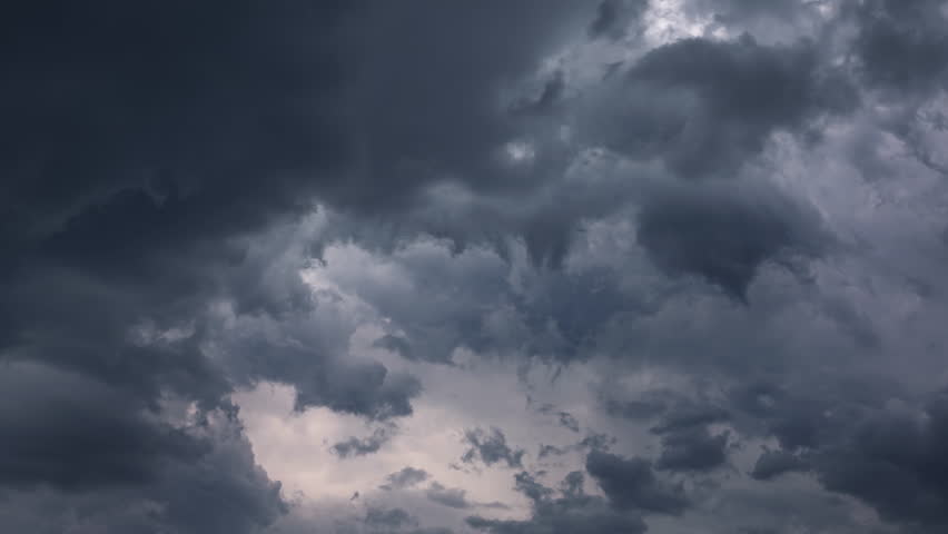 Dark storm clouds are moving fast at viewer, timelapse, 4k Royalty-Free Stock Footage #1100362181