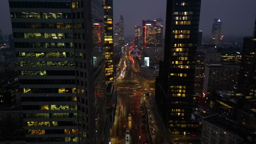 Night aerial shot of Warsaw skyscrapers, capital of Poland