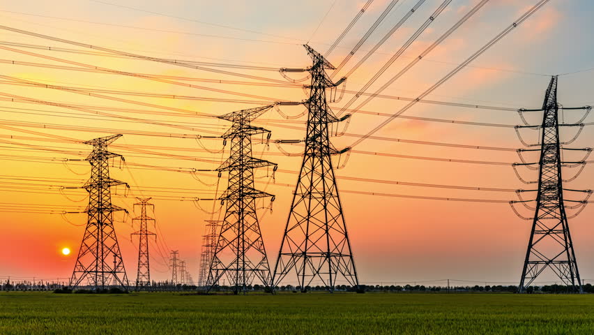 High voltage electric towers at sunset. Transmission power line. Electricity pylons and sky clouds background. | Shutterstock HD Video #1100365267