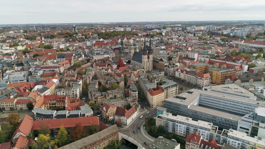 Flight over the city center of halle saale. view of the market church, red tower, cathedral and new residence. Saline and historic old town of Halle.