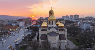 Varna city, Bulgaria 4k video, Scenic aerial panoramic view of the Cathedral of Assumption and city downtown during sunset