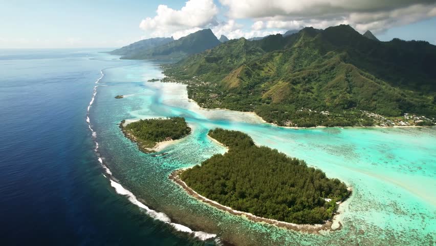 Aerial view, drone Tahiti. Moorea coastal landscape. French Polynesia. Tropical paradise. Exotic travel vacation getaway, romantic honeymoon destination. Royalty-Free Stock Footage #1100373503