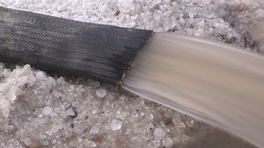 Toronto, Ontario, Canada January 2015 Broken water main flooding steam sinkhole in severe cold weather.