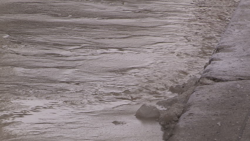 Toronto, Ontario, Canada January 2015 Broken water main flooding steam sinkhole in severe cold weather.