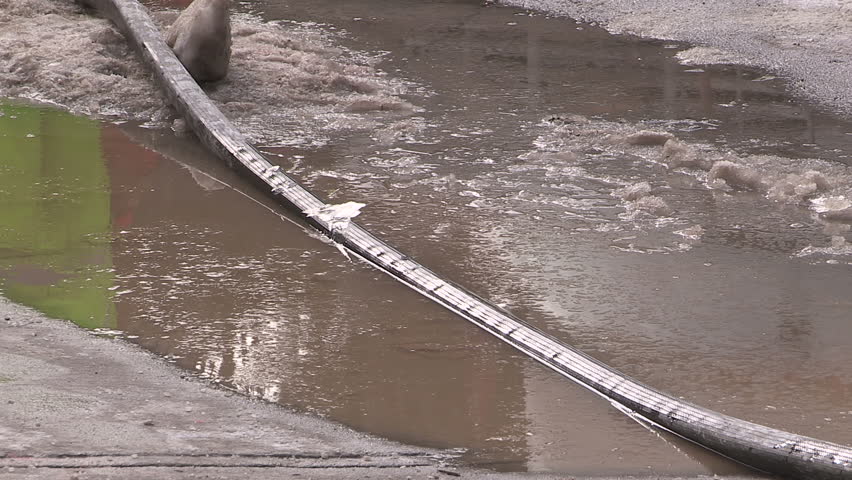 Toronto, Ontario, Canada January 2015 Broken water main flooding steam sinkhole in severe cold weather.
