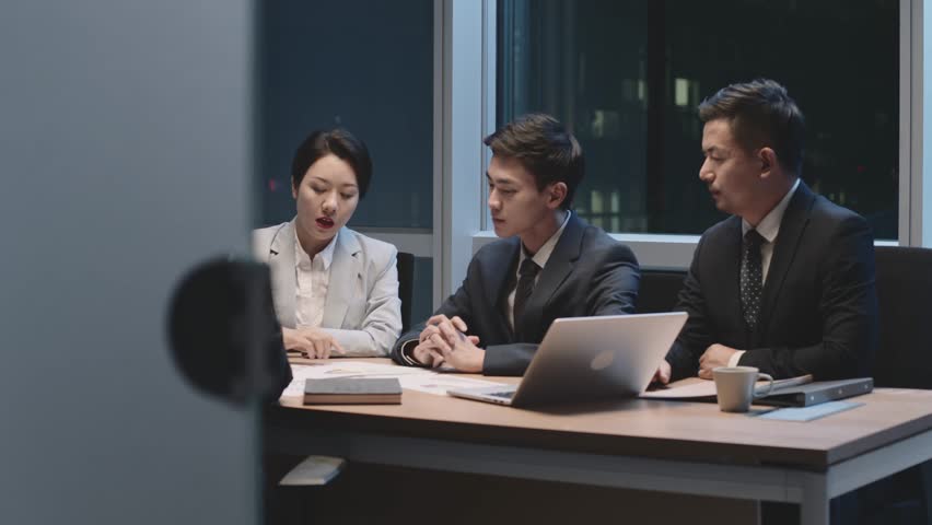 team of asian business people men and women working late meeting in office at night Royalty-Free Stock Footage #1100384305