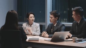 team of asian business people men and women working late meeting in office at night - Powered by Shutterstock - Get 15% off with code: PIKWIZARD15