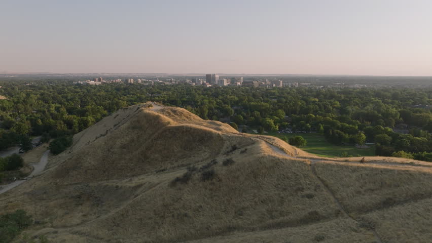 Aerial over Camels Back Park Boise Idaho moving towards downtown skyline