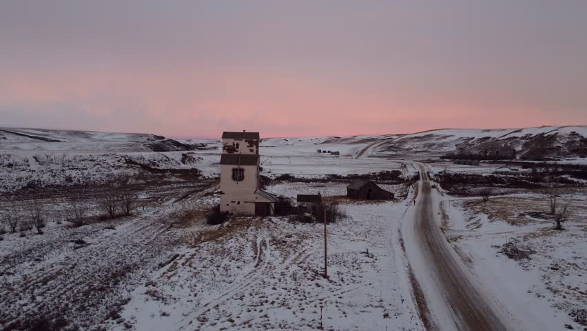 Old abandoned graine elevator in the ghost town of Sharples, Alberta at sunrise