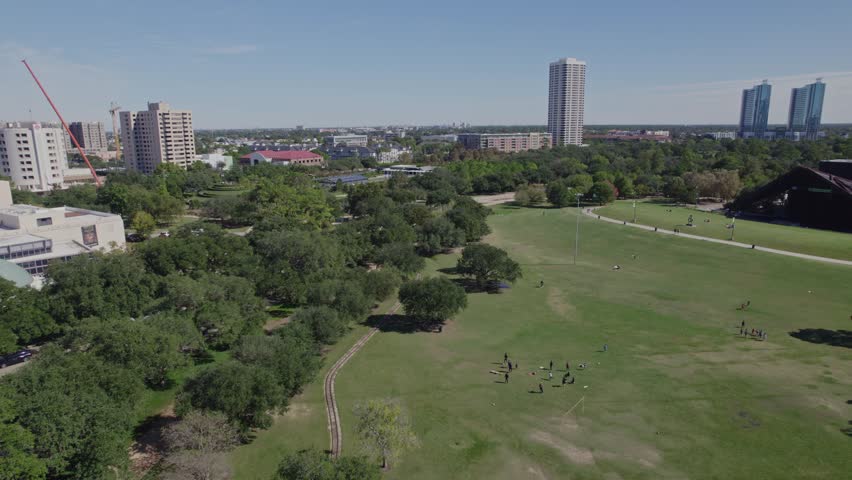 Aerial - Overview of Hermann Park with people on the grass - Houston, TX
