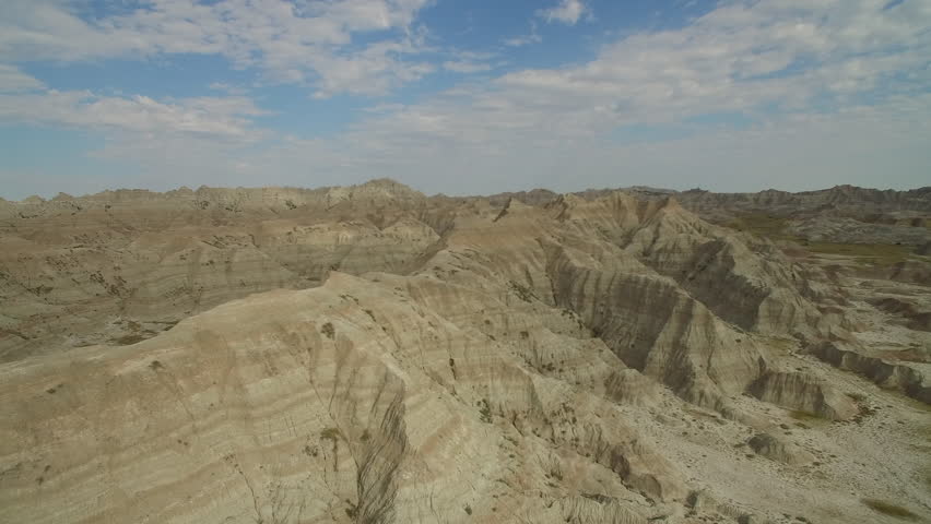Badlands South Dakota aerial 4K drone with beautiful blue sky straight out of a cinematic western film.