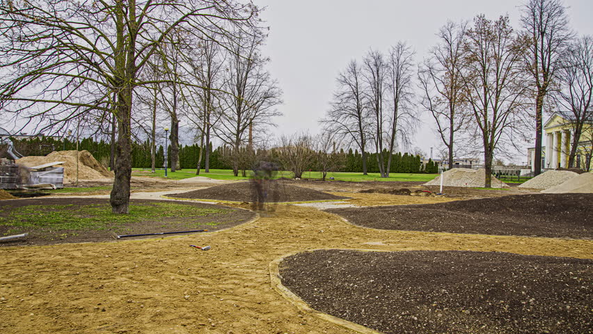Timelapse of people walking in an undeveloped dirt road with trees along the side