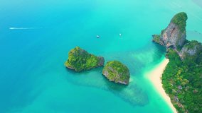 Aerial view over Railay Beach, coastal limestone mountains. Krabi, Thailand. One of the most beautiful tropical seas in the world. Incredible travel destinations on Earth. Travel and Nature concept
