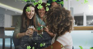 Animation of clover icons over diverse friends drinking beer. St patricks day and celebration concept digitally generated video.