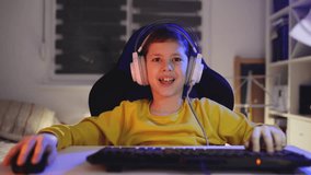 Young boy playing games on a computer at home - Powered by Shutterstock - Get 15% off with code: PIKWIZARD15