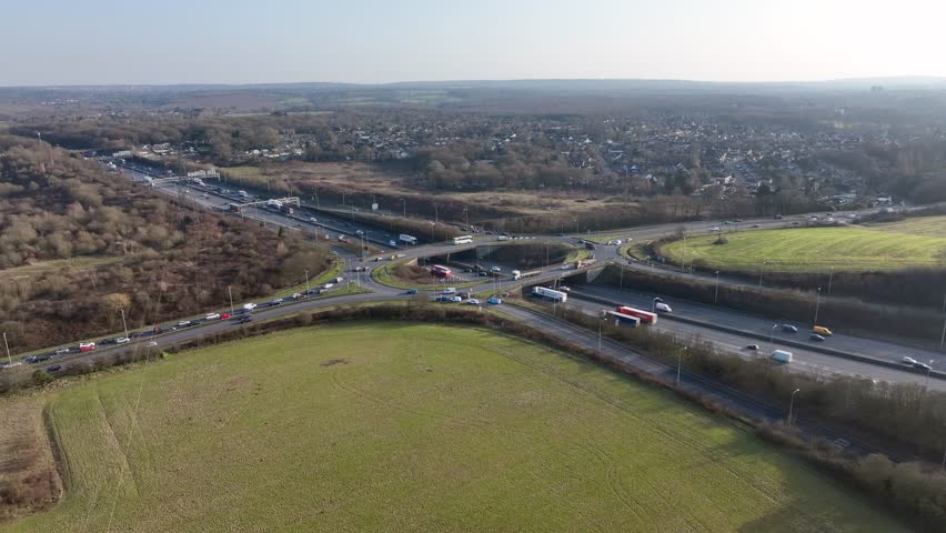 UK M25 Motorway Junction Aerial View at Rush Hour Royalty-Free Stock Footage #1100398731