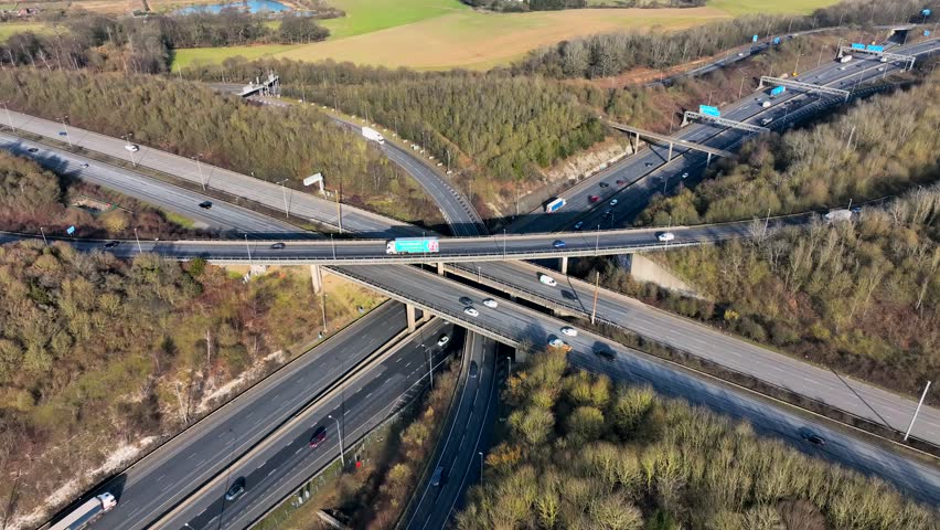 M1 and M25 UK Motorway Interchange Rush Hour Aerial View Royalty-Free Stock Footage #1100398745