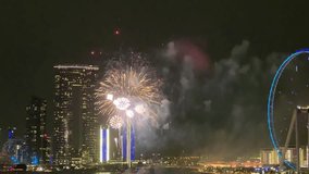 Dubai fireworks, Dubai frame building, ferris wheel, night time, vertical video - Powered by Shutterstock - Get 15% off with code: PIKWIZARD15