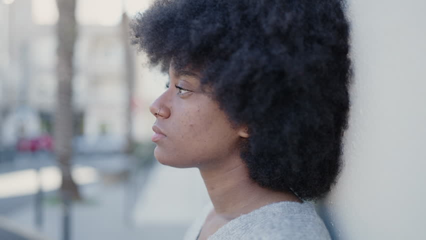 African american woman standing with sad expression at street | Shutterstock HD Video #1100409215