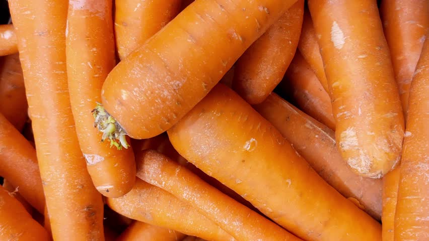 Lots of carrots, top view. Benefits of carrots, washed carrots, vitamin A Royalty-Free Stock Footage #1100412811