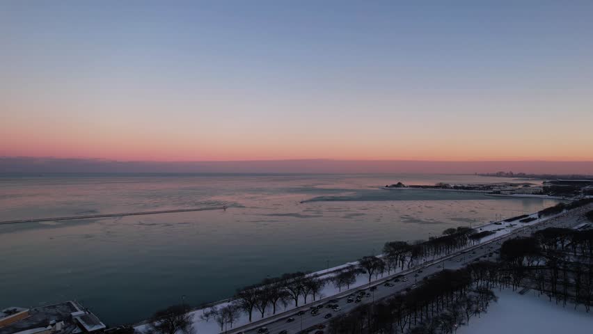 Lakeshore Drive highway from chicago and Lake michigan at the sunset, rush hour. Aerial 4k