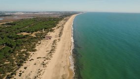 Drone Video Descending Over Huelva Beach a popular Spanish tourist destination, in the Daytime