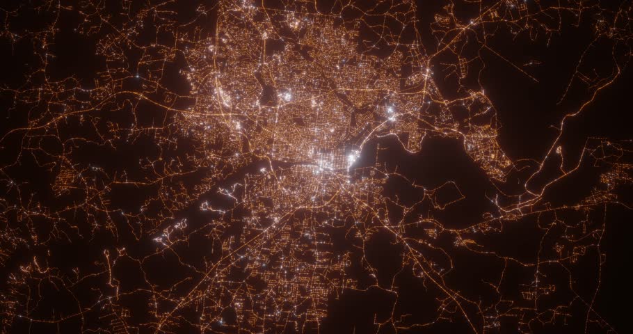 Columbus (Georgia, USA) aerial view at night. Top view on modern city with street lights. Camera is zooming out, rotating clockwise. Vertical video. The north is on the left side