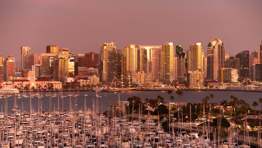 San Diego Downtown Skyline Telephoto Sunset from Harbor Island Tilt Up Time Lapse California USA