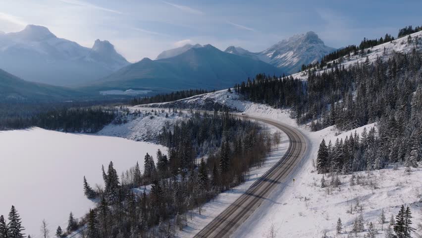 Bow Valley Trail highway road winding through the Bow Valley in the Canadian Rockies during winter in Dead Man