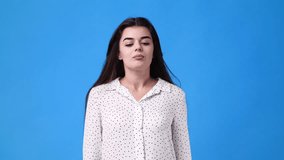 4k video of girl begging please on pink background.