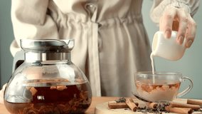 Cup Black Milk Tea . Brewed Herbal Leaf. Pouring Milk On Tea Cup. Indian Masala Chai. Morning Breakfast Hot Teapot. Brewing Tea Milk On Hot Teapot Morning. English Breakfast Hot Drink Chai From Cattle - Powered by Shutterstock - Get 15% off with code: PIKWIZARD15