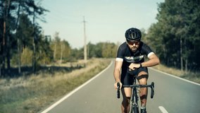 Cycling Training Monitoring Pulse Activity Tracker Smart Watch Or Smart Band. Biker Checking Heart Rate. Cyclist Watch App GPS Fitness Tracking Cycling Bike. Cyclist Check Pulse On Fitness Bracelet - Powered by Shutterstock - Get 15% off with code: PIKWIZARD15