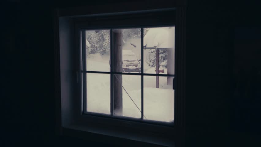 Snow Landscape Seen On A Small Window Of A Cabin. Close up